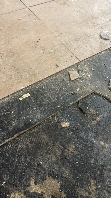 Black bitumen mastic floor removal in a W3 flat